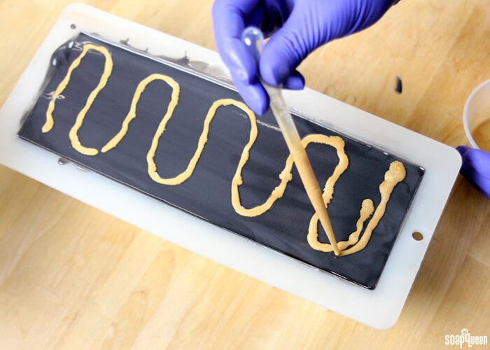 Mica painting is a great way to add color and sparkle to cold process soap. Learn how in this blog post!