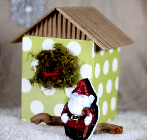 A Gnome like Santa Soap in front of his quaint home. A Gnome like Santa Soap in front of his quaint home.